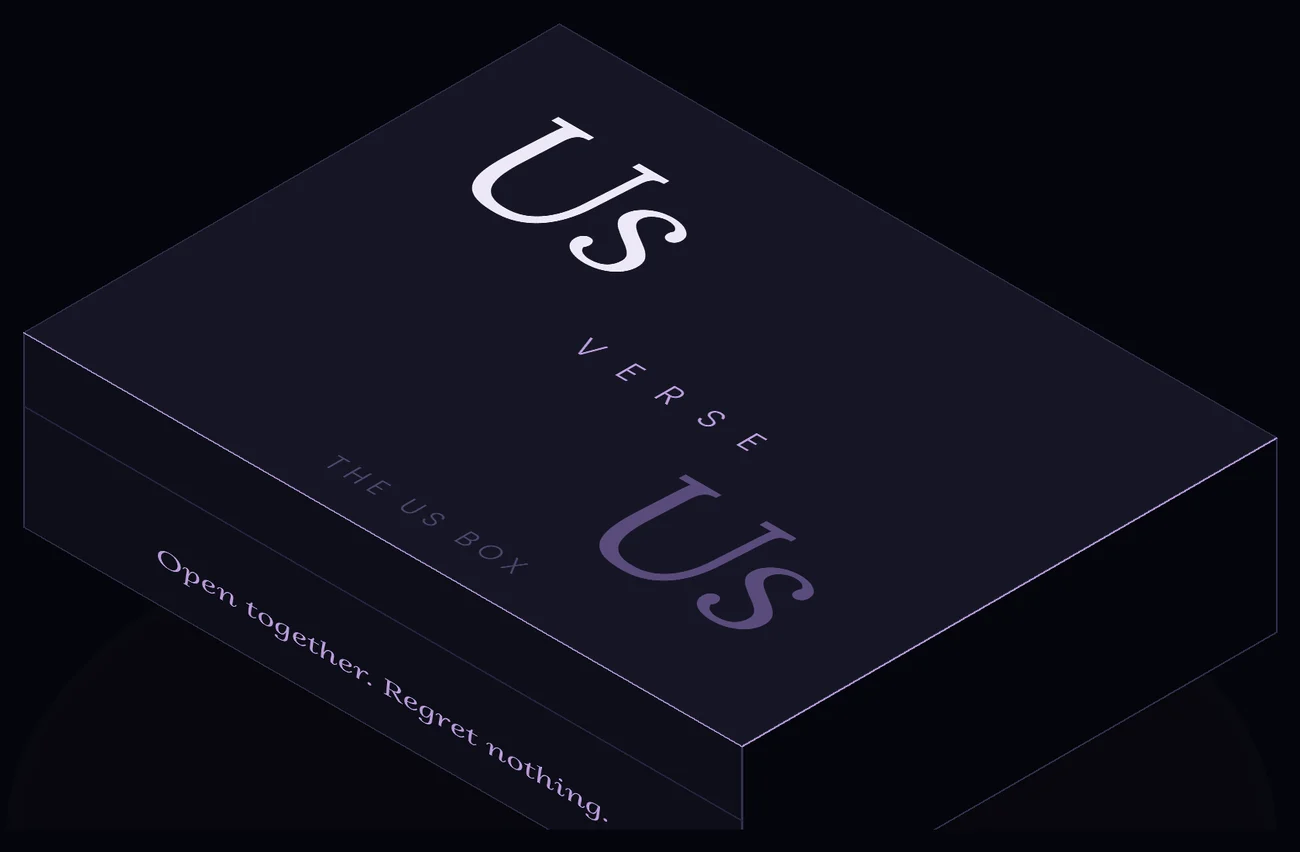 The US Box, closed: rigid matte black box with Us Verse Us in violet foil